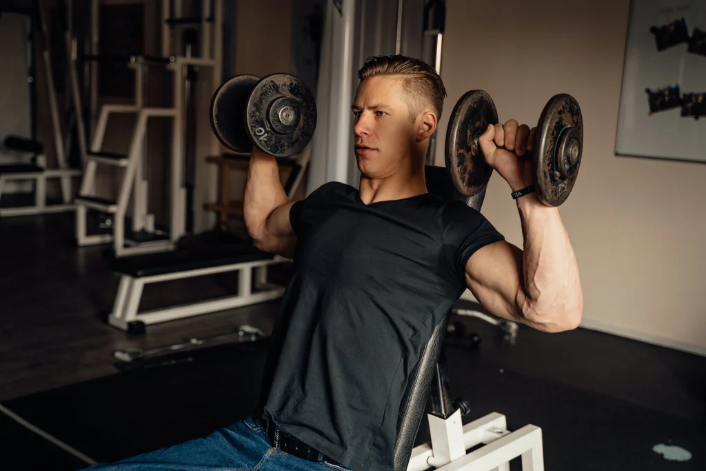 man-performing-shoulder-press-one-of-the-best-deltoid-exercises
