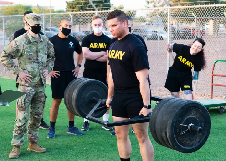 Army body fat – soldiers performing outdoor weightlifting training for fitness assessment