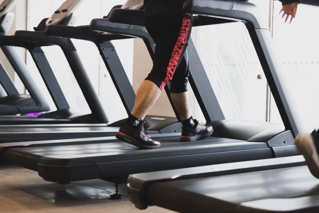 calories burned walking – person walking outdoors on a fitness walk to burn calories