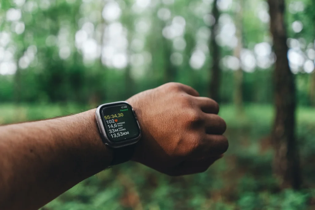 heart rate calorie tracking – person exercising and monitoring heart rate for calorie estimation