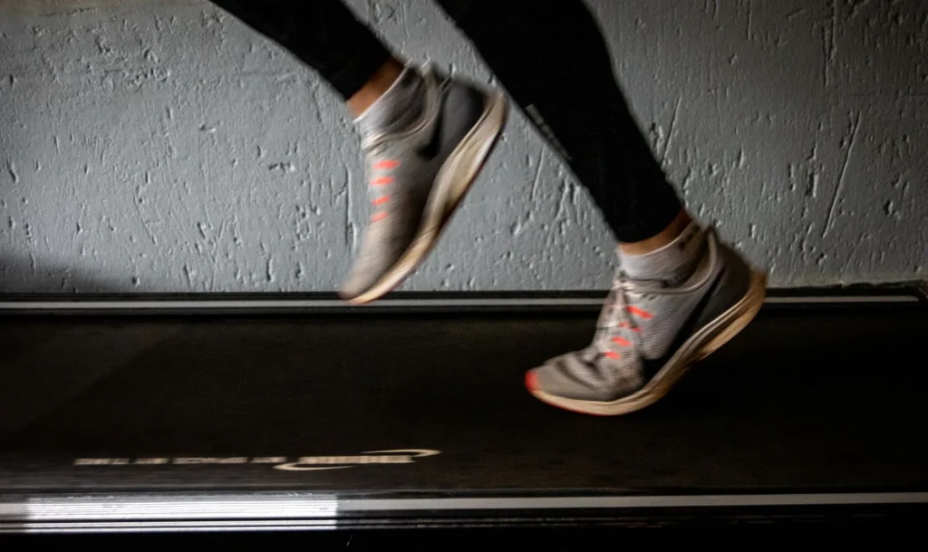 Runner jogging outdoors burning calories during a workout