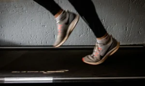 Runner jogging outdoors burning calories during a workout