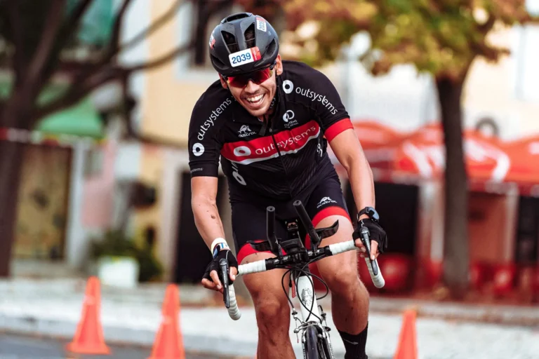 Smiling cyclist on a road bike — how many miles to burn 1,000 calories cycling