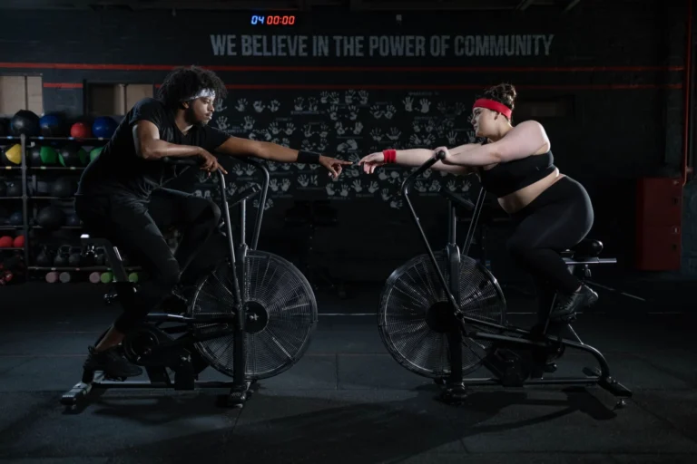 stationary bike workout – person cycling on indoor exercise bike for calorie burn