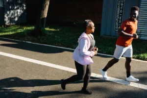 Person walking outdoors for weight loss on a sunny day