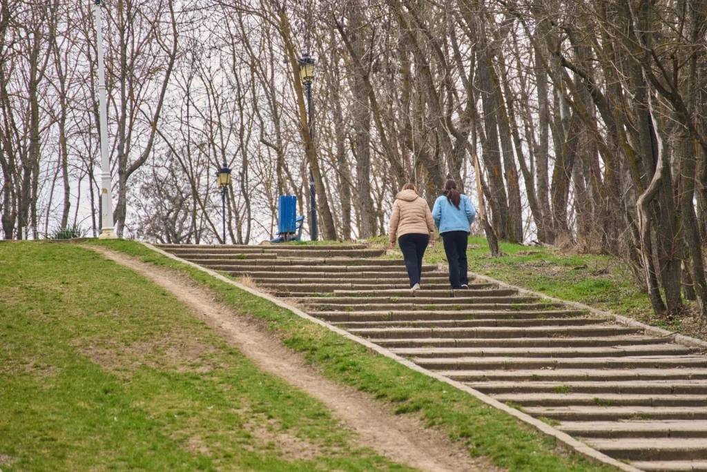 walking miles and steps measurement – person walking outdoors counting steps for fitness tracking