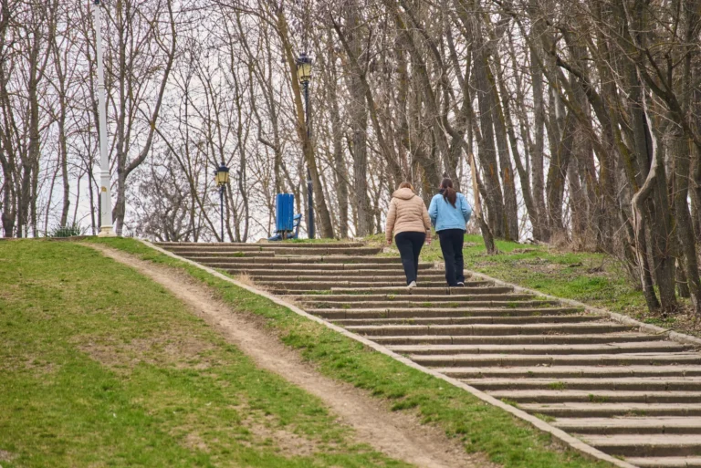 walking miles and steps measurement – person walking outdoors counting steps for fitness tracking