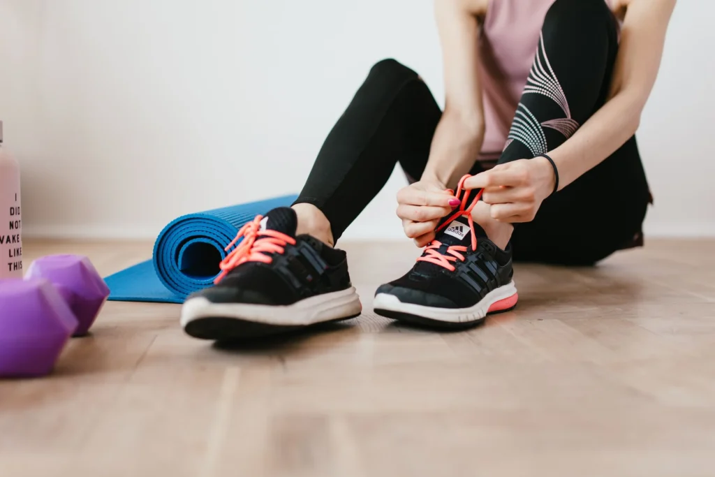 home workout – woman exercising at home without equipment for fitness