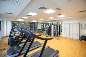 rowing machine weight loss – gym with cardio fitness machines and equipment for fat loss training