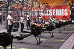 rowing machine technique – competitors rowing on machines during an indoor fitness event